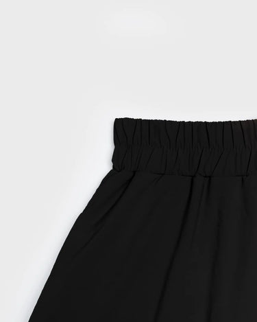 Black vegan skirt with elastic waistband made from recycled materials. - The New Orchard CH