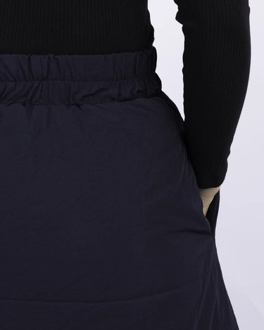 Navy blue vegan skirt made from recycled materials with elastic waistband and side pockets. - The New Orchard CH