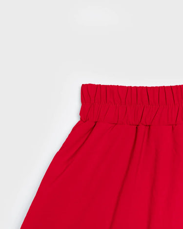 Vivid red vegan winter skirt with gathered elastic waistband made from recycled materials. - The New Orchard CH
