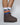 White breathable rainbow socks worn with shoes, highlighting their comfortable fit and everyday versatility.