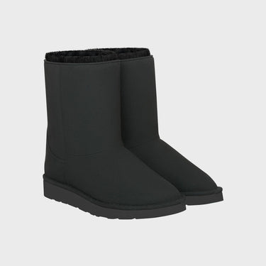 Pair of black vegan boots on a light gray background