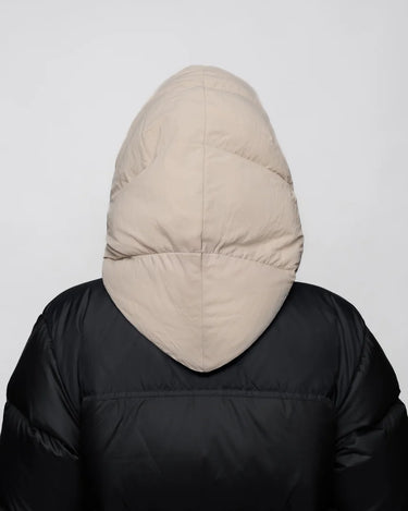 Light beige vegan winter hood made from recycled materials on black puffer jacket from back view. - The New Orchard CH