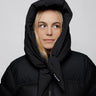 Black puffer jacket with large hood made from vegan, recycled materials, zipped front closure. - The New Orchard CH