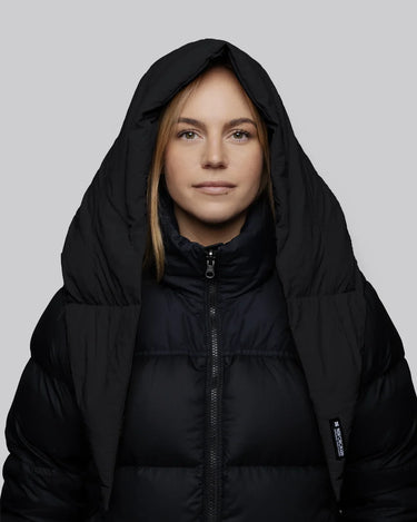 Black vegan puffer jacket with hood made from recycled materials, sleek charcoal tone. - The New Orchard CH