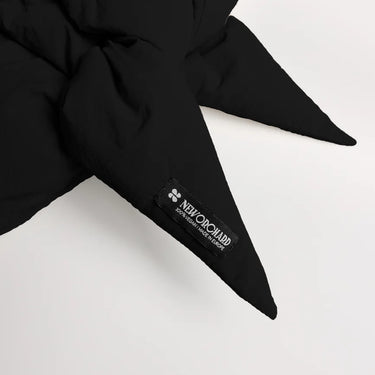 Black vegan winter capuche made from recycled materials with pointed ends and visible branded tag. - The New Orchard CH