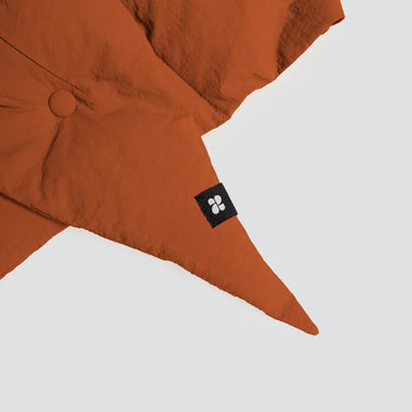 Vegan cinnamon-colored winter capuche made from recycled materials with button detail and logo tag. - The New Orchard CH