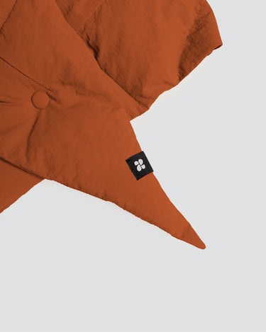 Vegan cinnamon-colored winter capuche made from recycled materials with button detail and logo tag. - The New Orchard CH