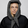Light grey vegan capuche hood made from recycled materials, styled with black puffer jacket. - The New Orchard CH