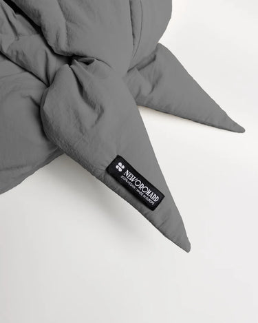 Light grey vegan winter capuche made from recycled materials with pointed ends and black branded label. - The New Orchard CH