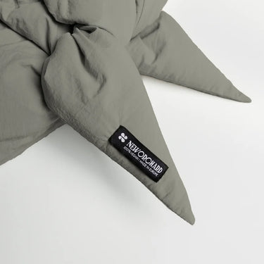 Khaki vegan capuche made from recycled materials with stitched pointed ends and branded label. - The New Orchard CH