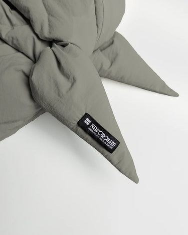 Khaki vegan capuche made from recycled materials with stitched pointed ends and branded label. - The New Orchard CH