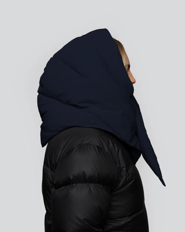 Navy blue vegan hood made from recycled materials, paired with black puffer jacket. - The New Orchard CH