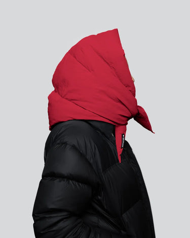 Vivid red vegan puffer hood made from recycled materials paired with black puffer jacket. - The New Orchard CH