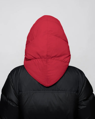 Vivid red vegan hood made from recycled materials on black puffer jacket, back view. - The New Orchard CH