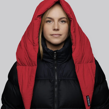 Vivid red vegan hood made from recycled materials paired with black puffer jacket. - The New Orchard CH