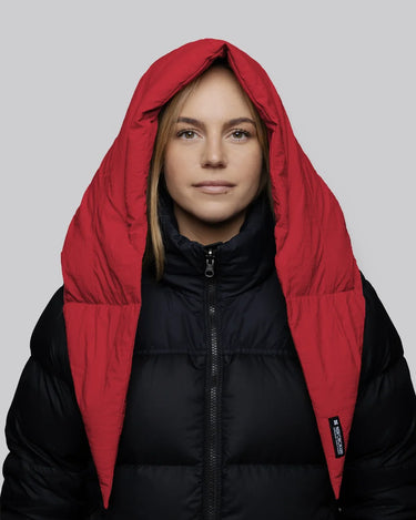 Vivid red vegan hood made from recycled materials paired with black puffer jacket. - The New Orchard CH