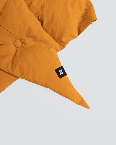 Amber yellow vegan winter capuche made from recycled materials with button detail and black logo tag. - The New Orchard CH